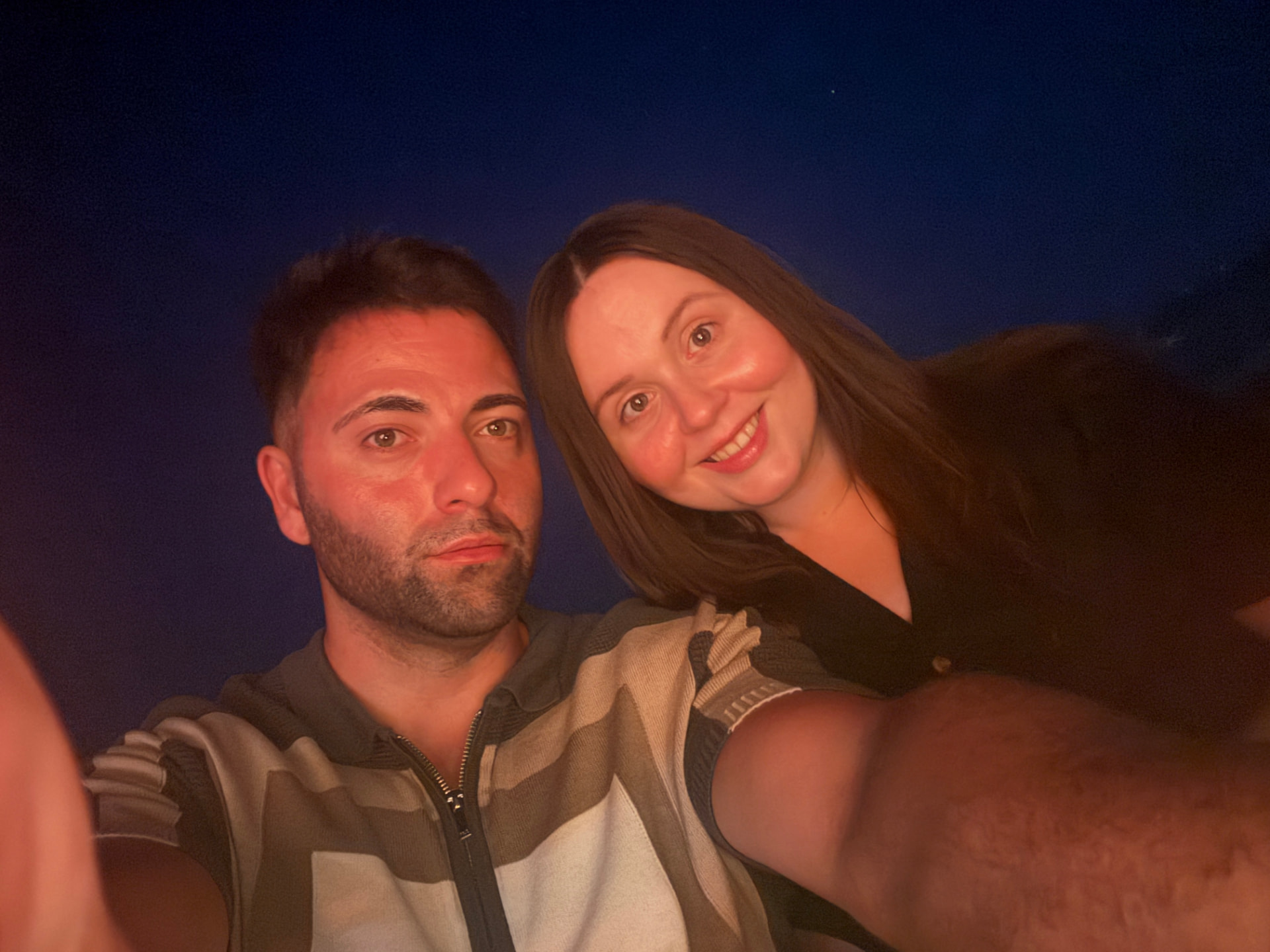 Adem and Fran under an evening sky