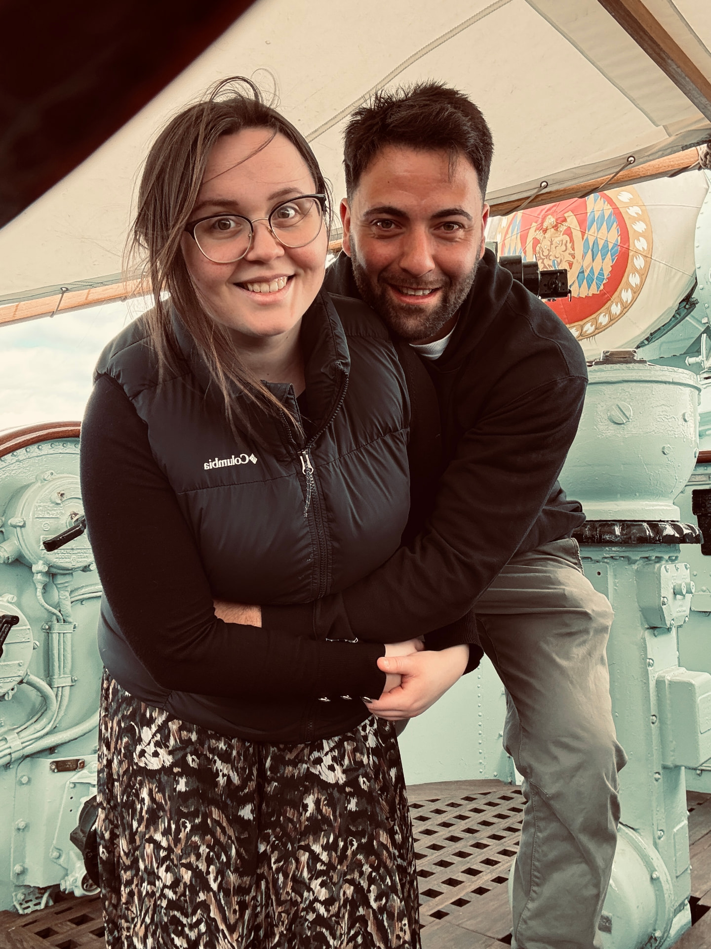 Adem and Fran on a stationary boat