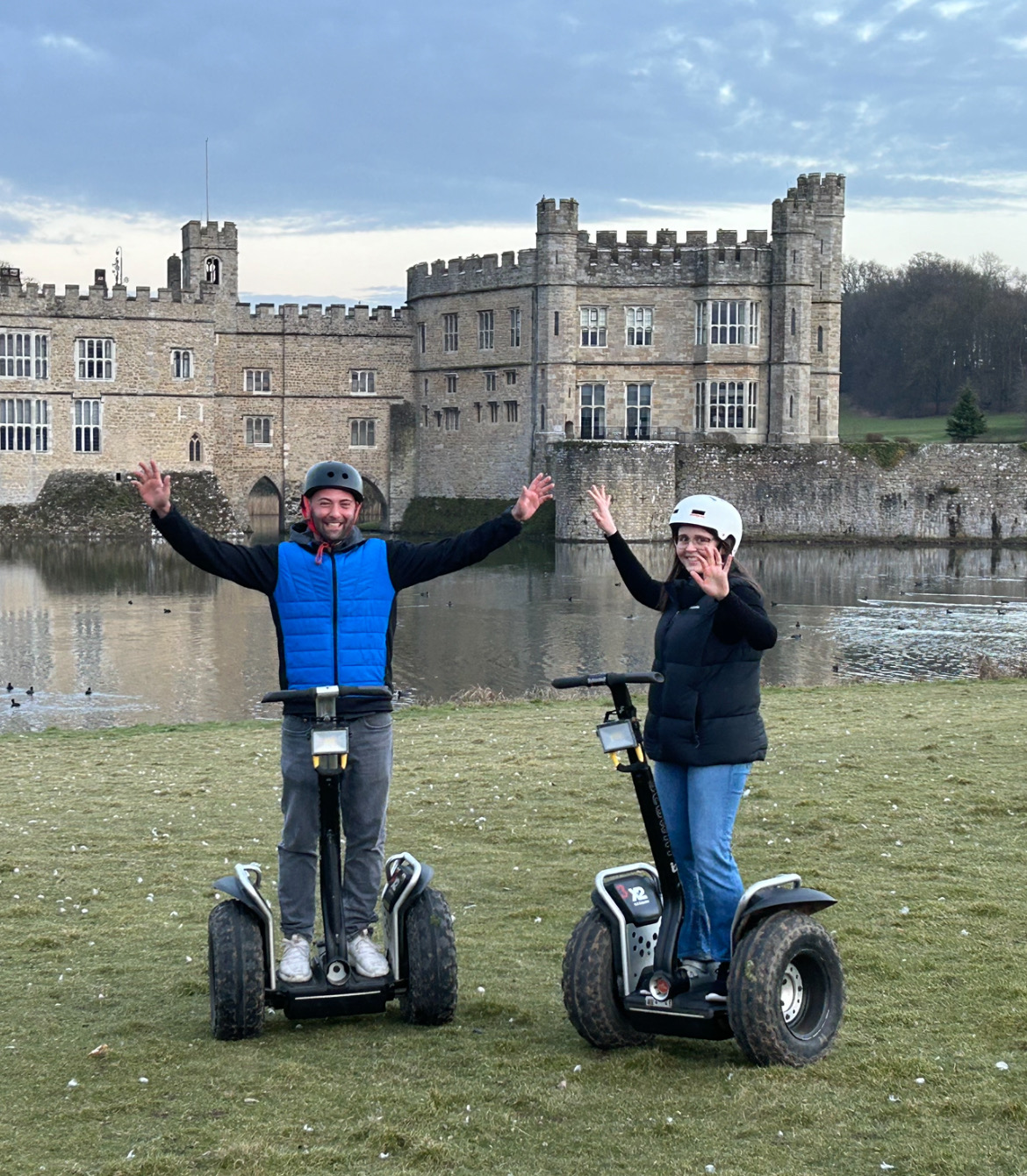 Adem and Fran on segways in front of Leeds Castle